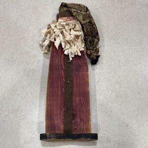 Rustic Wooden Santa Figurine with Red and Brown Accents